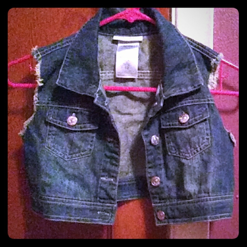 A sleeveless jean jacket